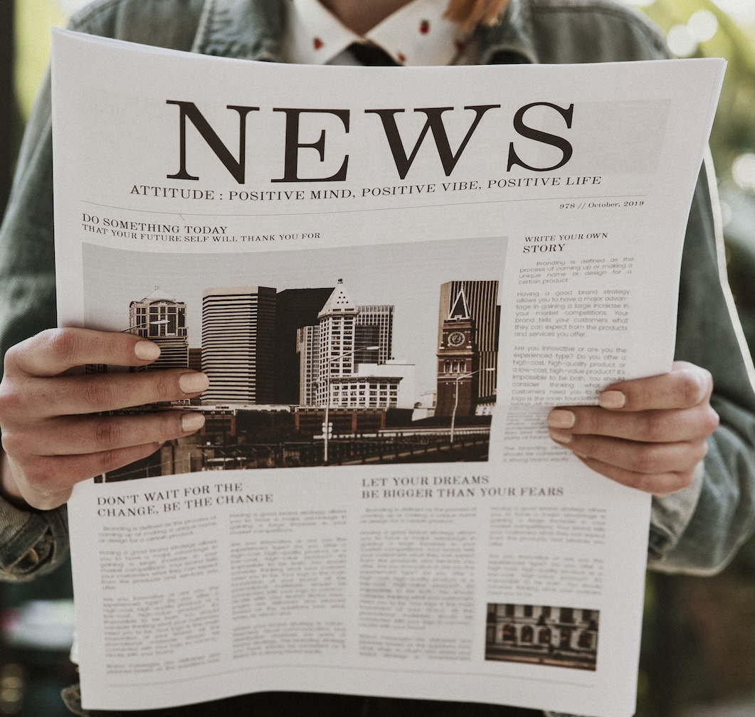 womanReadingNewspaper